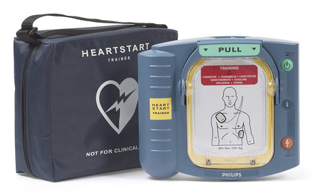 Philips HeartStart OnSite Trainer device with a labeled training pad next to a navy blue bag featuring a heart logo, ideal for cardiac arrest training.