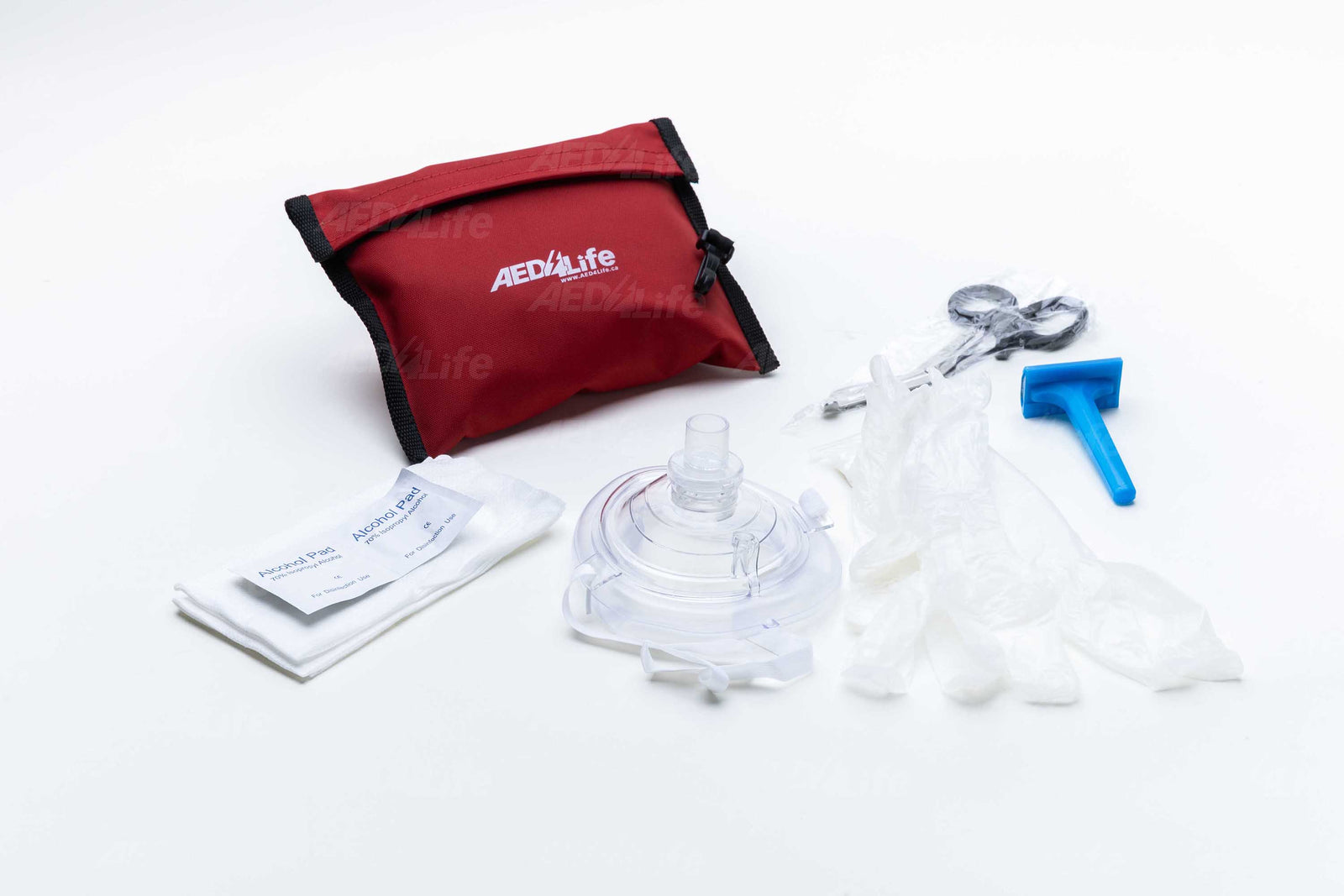The red emergency CPR kit, set against a white background, includes a mask, barrier, gloves, and tools to complement your Philips HeartStart Home Package for preparedness in sudden cardiac arrest situations.