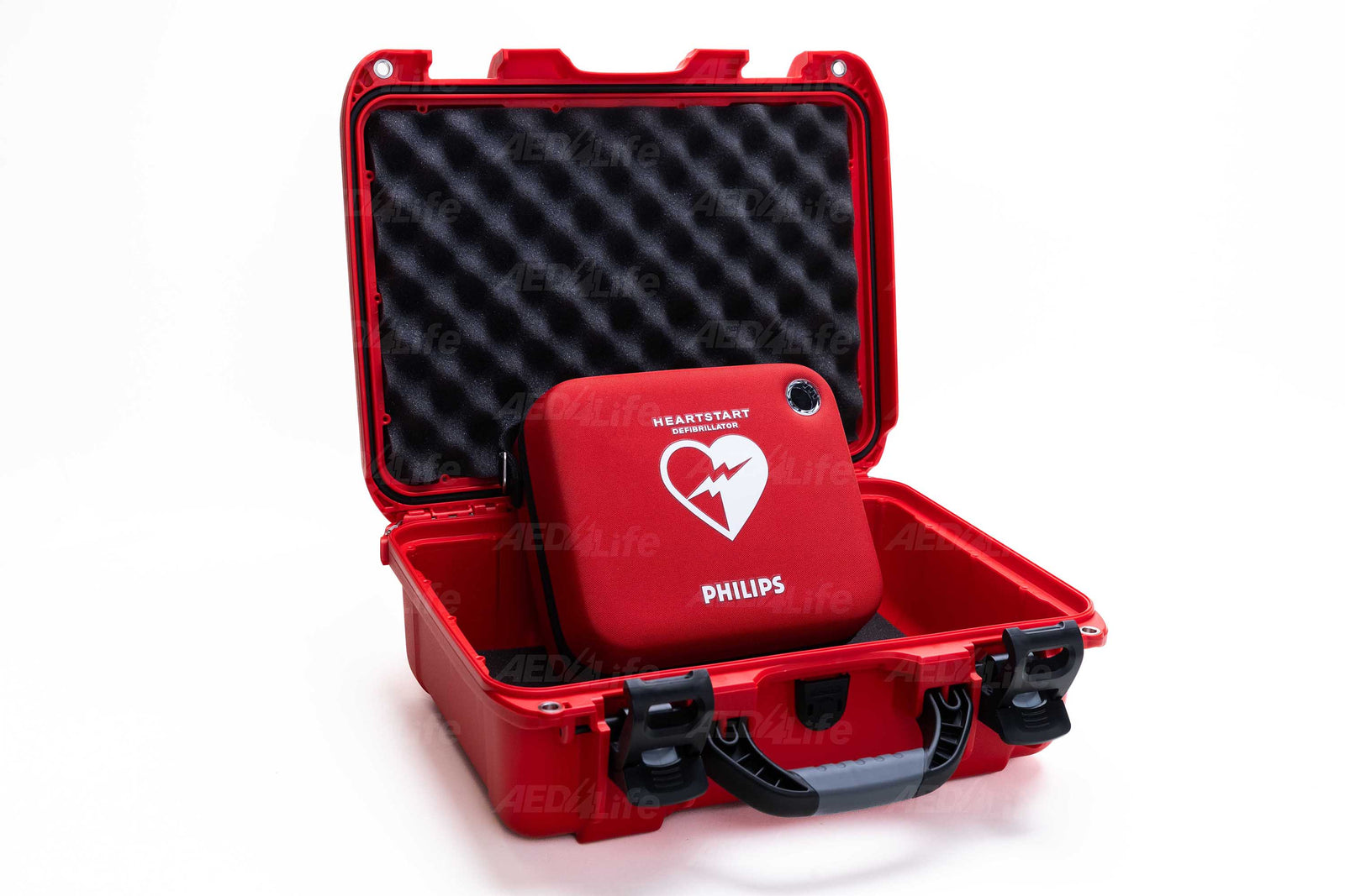 An open red case reveals the Philips FRX Grab & Go AED Bundle by The AED Shop, displayed against a white background.