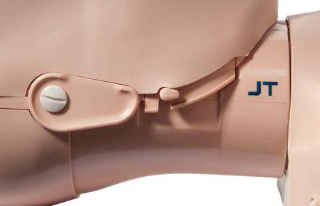 Close-up of a beige prosthetic limb with a small lever and the initials "JT" printed on the side, resembling parts from the Prestan Jaw Thrust Head Assembly for Adult Manikin.