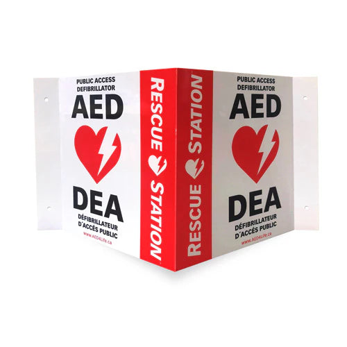 Red and white wall sign with heart and lightning bolt icon, in English and French, marks the location of the Philips FRX Grab & Go AED Bundle by The AED Shop. Indicates placement of a portable automated external defibrillator kit.