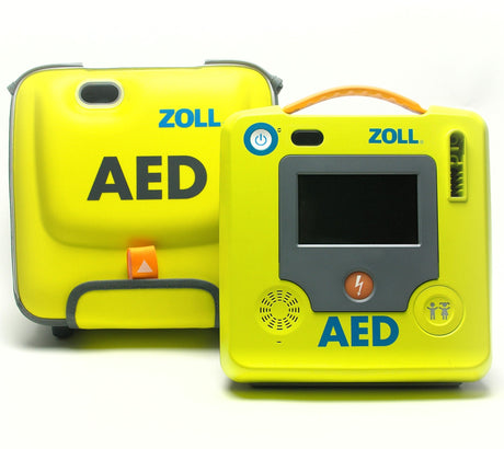 The ZOLL AED 3 with Carry Bag Package includes two yellow Zoll AED devices: one in a compact carry case and the other featuring a screen and buttons, both clearly labeled "AED." Designed for cardiac emergencies, the ZOLL AED 3 is an advanced Automated External Defibrillator crafted for prompt intervention.
