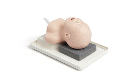 A foam block secures the Neonatal Intubation Trainer Laerdal, showcasing a lifelike infant CPR mannequin head on a tray.