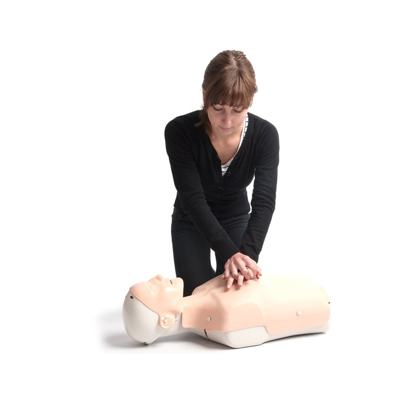 Person practicing CPR on a training mannequin against a plain white background.