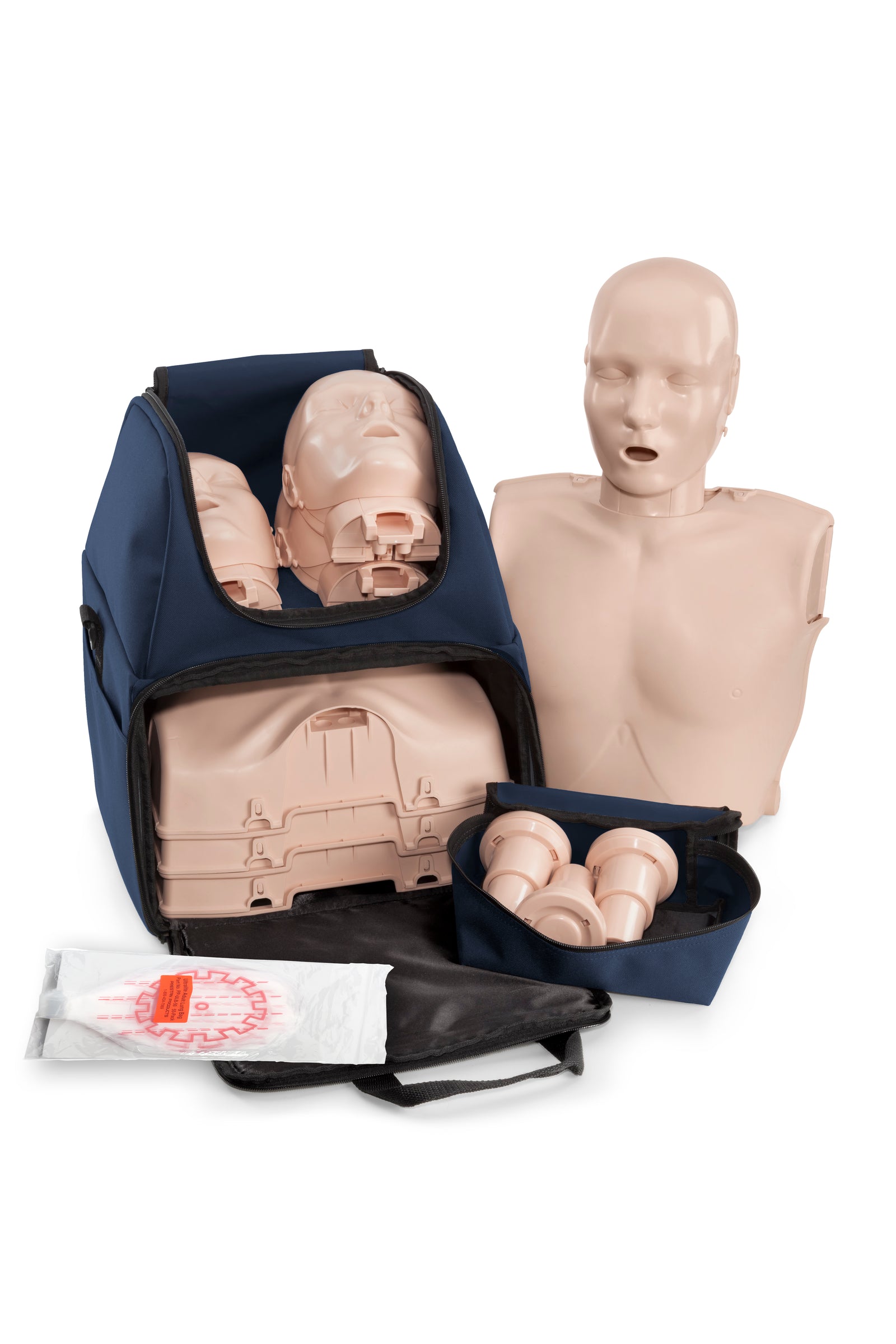 A CPR training manikin kit with torsos, heads, and accessories in a blue carrying bag on a white background.
