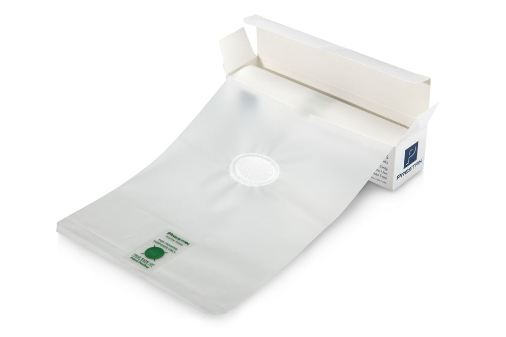 A white medical pouch featuring a circular filter is placed on the surface, similar to Prestan's CPR Practice Shields (36 on roll - box), which are used in CPR training as effective biological barriers.