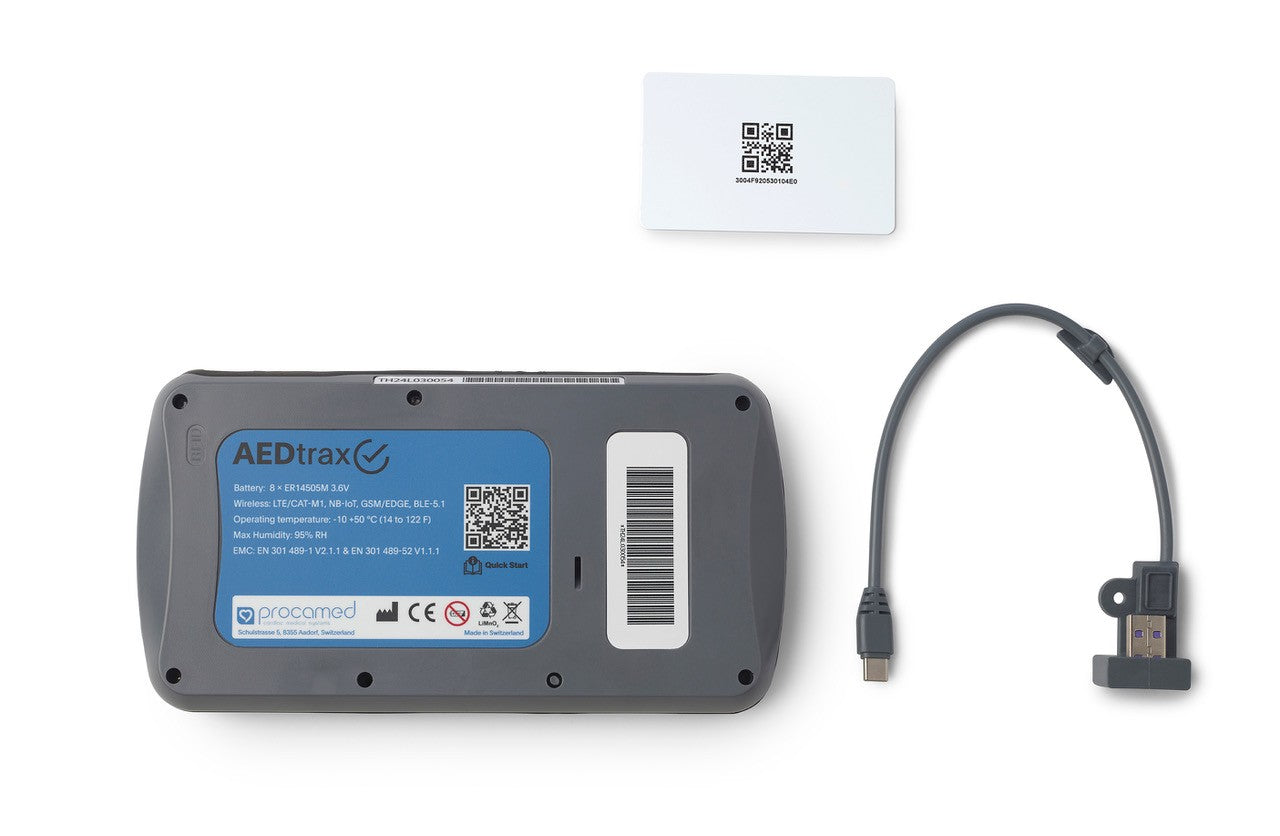 AEDtrax by The AED Shop shown with a blue label, white card, and short data cable on a white background—perfect for AED monitoring in any environment.