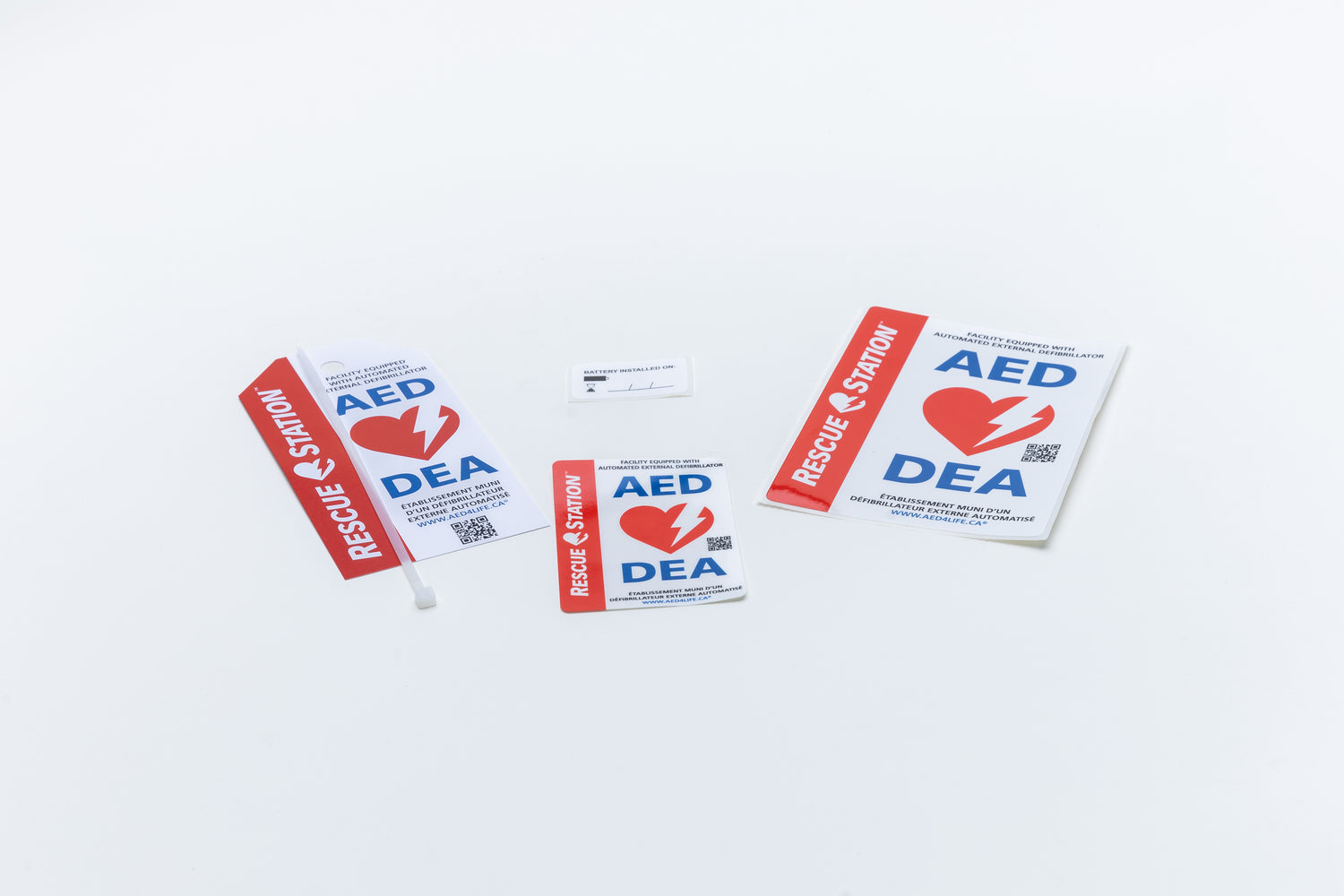 Purchase the AED Shop Inspection Tag set of 5, featuring red heart and lightning bolt designs on a light background. Ideal for expedited delivery via Canada Post, these decals ensure safety is always visible.