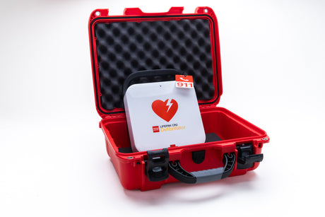 The Physio-Control/STRYKER LIFEPAK CR2 Bilingual (WiFi enabled) Grab & Go Bundle comes in a red protective case with foam padding and a 911 emergency tag.