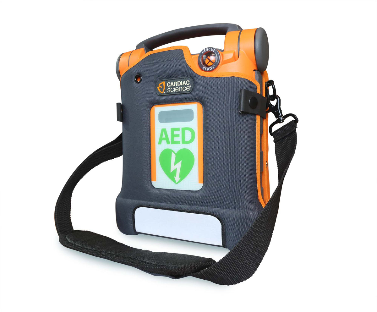 Cardiac Science G5 BILINGUAL AED by Cardiac Science: a portable automated external defibrillator featuring an orange and gray casing with an “AED” label and heart symbol on the front screen; includes a strap and provides real-time CPR feedback for optimal emergency response.