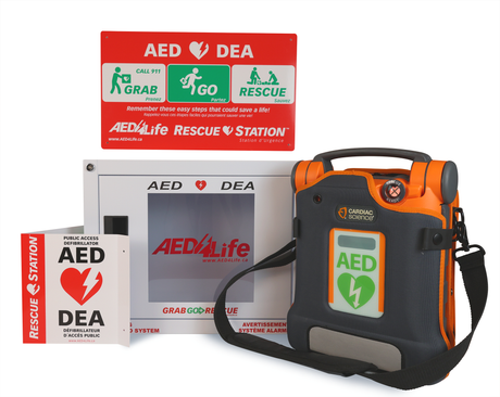 Cardiac Science G5 BILINGUAL AED - Complete Package by Cardiac Science includes an orange semi-automatic defibrillator with Rescue Ready technology, clear emergency instructions, rescue station signage, and is designed for public use.