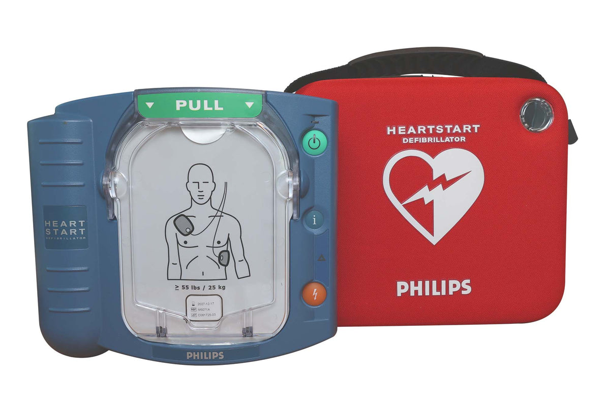 The Philips HeartStart OnSite Defibrillator by Philips, shown in blue with an electrode pad diagram and placed next to a red carrying case labeled “HeartStart,” is an excellent automated external defibrillator for home use.