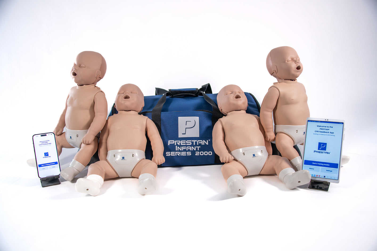 Four Prestan Infant Series 2000 CPR Training Manikins with Monitors by The AED Shop, a blue carrying bag, and two smartphones with the CPR Feedback App—perfect for Heart and Stroke Foundation resuscitation training.
