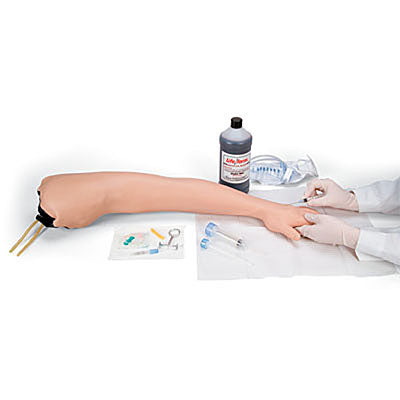 A Life/form Adult Venipuncture and Injection Training Arm in light skin tone, accompanied by a bottle of simulated blood, various medical tools, and gloved hands preparing for venipuncture training.