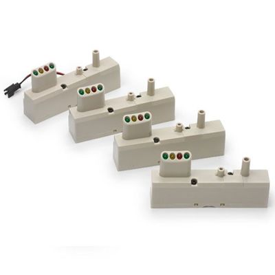 Four beige connectors with multicolored wires on top, expertly designed to integrate smoothly into the Prestan Professional setup, come as part of the Monitors for Prestan Child Manikin (4-pack) by Prestan.