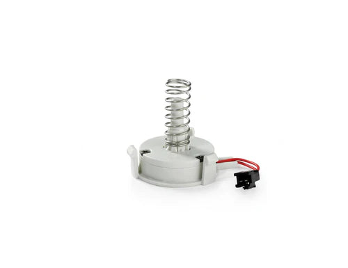 The Clicker for PRESTAN Professional Infant Manikin by AEDShop, featuring a metal spring with a white base and an attached red wire, rests on a plain background.