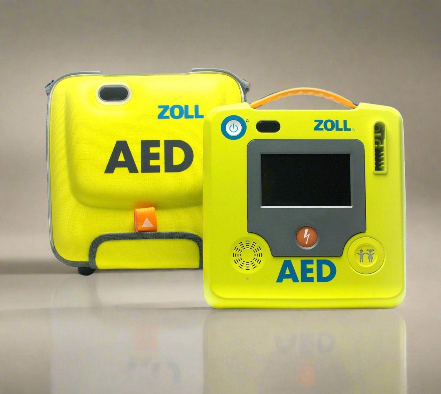 Two yellow ZOLL AED 3 devices, one in a carrying case from the Carry Bag Package and the other featuring a display screen, shown against a neutral background. These Automated External Defibrillators by ZOLL are vital tools for responding to cardiac emergencies.