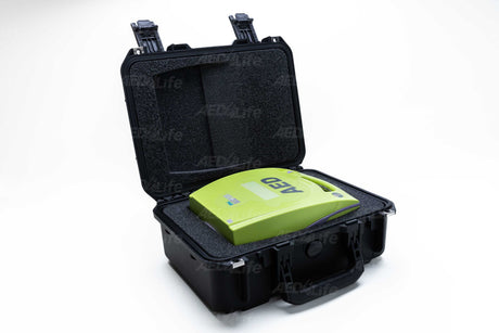 Open ZOLL AED Plus Small Pelican Case in black, featuring a bright green ZOLL AED Plus device inside, crafted for durability and reliability.