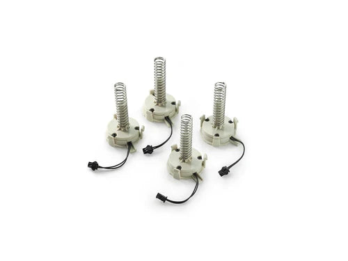 The Clicker for the PRESTAN Professional Adult Manikin by AEDShop has four coil springs affixed to round bases with black wires, all set against a white background.