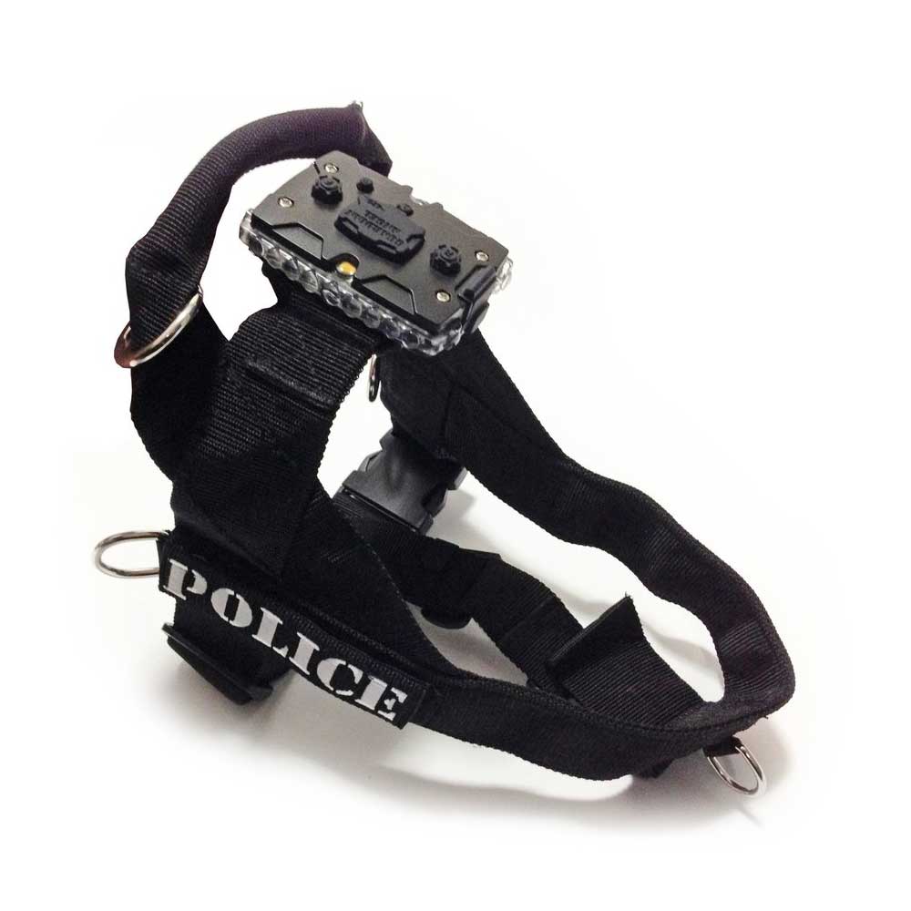 Guardian Angel's black tactical canine harness, labeled "POLICE," includes a strap clip mount for easy adjustments and a durable LED safety light attachment on top.
