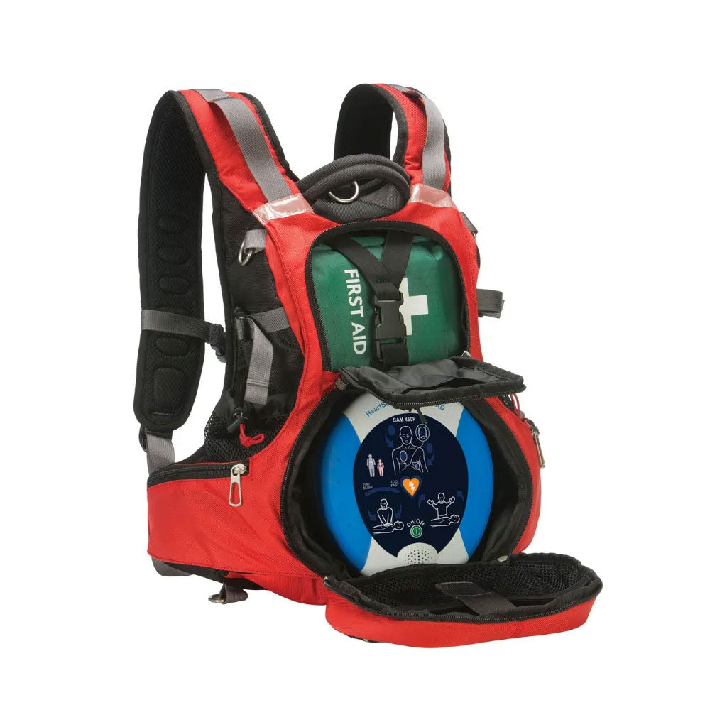 Red first aid backpack with a green kit and a visible AED inside, ideal for emergency medical situations.