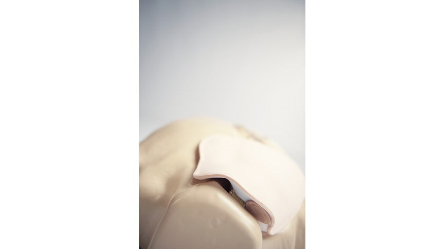 Close-up of the face and chest area of the Laerdal IV Torso Basic, highlighting the mouth and nose region, designed for practicing realistic procedures.