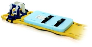 Yellow spine board with blue head immobilizer and blue padding, used for patient transport and stabilization.